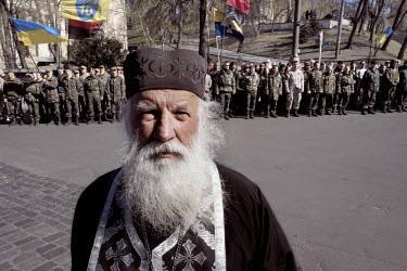 An Orthodox priest on Hrushevskoho Street during a memorial held on the 40th day after the deaths of many protestors in clashes with security forces in Kiev. Events that led to the collapse of the rul...