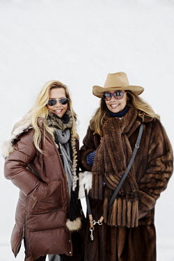 Twin sisters Caerstin Brander (48) from Zurich and Birgit Caren Machenbach (48) from Hamburg attending the 30th Polo on Snow World Cup.