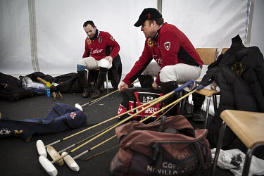 Hissam Ali Hyder (L), the world's best player and Team Cartier patron Jonathan Munro Ford prepare in their team tent before the semi-final of the 30th Polo on Snow World Cup. In polo the team patron i...