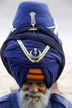 A Sikh soldier wearing a purple ceremonial turban at the Bangla Sahib Gurdwara.
