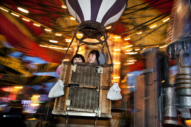 Children on a fair-ground ride in Saint Catherine.