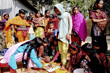 Info Lady Jeyasmin weighs girls at her weekly session for adolescents during which she shows them educational videos and offers advice. In rural Bangladesh the Info Ladies are bringing internet servic...