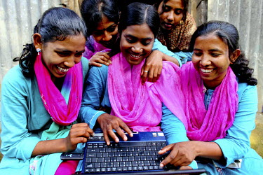 A group of Info Ladies at one of their regular get-togethers where they meet to exchange information. In rural Bangladesh the Info Ladies are bringing internet services to men and women who need infor...