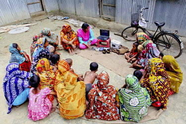 Info Lady Shathi shows videos to a group of women in a rural village. In rural Bangladesh the Info Ladies are bringing internet services to men and women who need information but don’t have the mean...