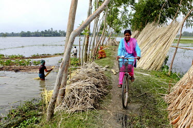 Info Lady Mahfuza rides her bicycle during her rounds to remote villages. In rural Bangladesh the Info Ladies are bringing internet services to men and women who need information but don’t have the...