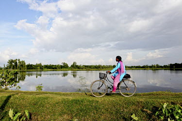 Info Lady Mahfuza rides her bicycle during her rounds to remote villages. In rural Bangladesh the Info Ladies are bringing internet services to men and women who need information but don’t have the...