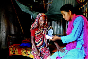 Info Lady Farhana measures 80 year old Shahida Begum's blood pressure and after getting a low reading makes dietary recommendations based on what she has researched on the internet, in accordance with...