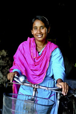Info Lady Shathi sets out on her bicycle. In rural Bangladesh the Info Ladies are bringing internet services to men and women who need information but don’t have the means to access the web. After t...