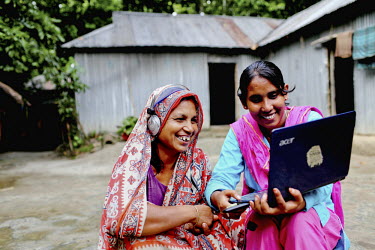 Info Lady Shathi helps 50 year old Kohinur Begum to Skype with a relative. In rural Bangladesh the Info Ladies are bringing internet services to men and women who need information but don't have the m...