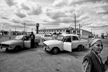 Drivers and their Soviet era cars in the town centre. During the 1950s and the 1960s the rivers that feed the Aral Sea (the Amu Darya and the Syr Darya) were diverted for irrigating cotton and other c...