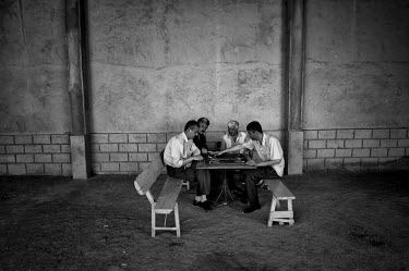 Men play chess in an empty building. During the 1950s and the 1960s the rivers that feed the Aral Sea (the Amu Darya and the Syr Darya) were diverted for irrigating cotton and other crops. This caused...