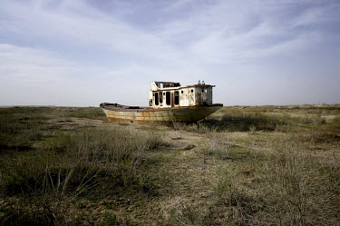 The remains of an abandoned trawler left to decay on what was once the Aral Sea's shore, now about 40 kms distant. During the 1950s and the 1960s the rivers that feed the Aral Sea (the Amu Darya and t...