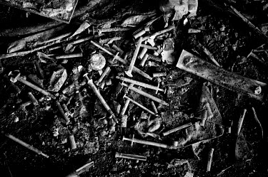 Discarded syringes clutter the floor of a block in the Vele di Scampia (Sails of Scampia), a housing complex (by architect Franz di Salvo) built during the 1960s and early 1970s. Seven separate Ziggur...