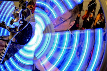 A mechanic fixes light elements to a bicycle for a cycling light show which anticipates Yorkshire's hosting of the Grand Depart, the first two stages of the 2014 Tour de France. Road racing bikes and...
