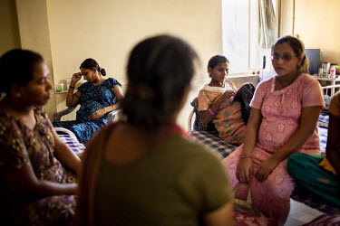 Surrogate mothers pass their time doing embroidery and watching television in the surrogate's hostel on the 3rd floor of Dr. Nayana Patel's Akanksha IVF and surrogacy centre.The women spend their enti...