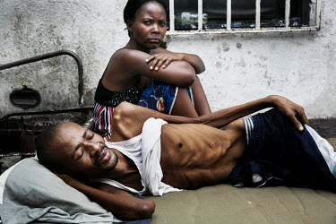 Fuila Batila and his wife rest in the small hotel room where he is living. Fuila has multi resistant TB and although his wife cares for him the family has no money for his treatment. They are living i...
