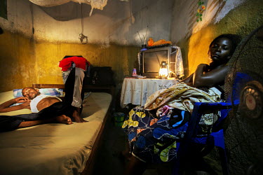 Fuila Batila and his wife rest in the small hotel room where he is living. Fuila has multi resistant TB and although his wife cares for him the family has no money for his treatment. They are living i...