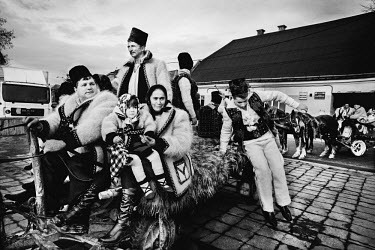 People arrive by carriage for the Maramures Winter Festival.