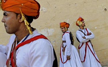 Traditional folk dancers rest in between thier day long performances at Mehrangadh Fort during the  Rajasthan International Folk Festival.