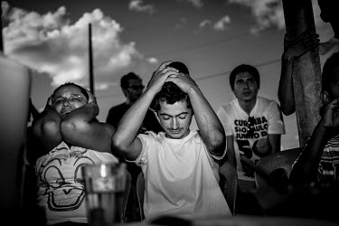 Locals react to the results of the penalty shootout between Brazil and Chile in their World Cup game. Brazil ultimately won it with a score of 3 to 2.