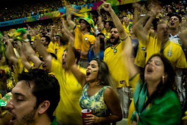 Fans celebrate their national team after Brazil defeats Colombia in the quater final of the 2014 World Cup in Fortaleza. Brazil won 2:1.