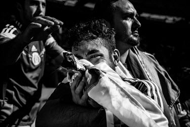 A Mexican fan cries in despair after Mexico lost to the Netherlands (2:1) in the World Cup in Fortaleza.