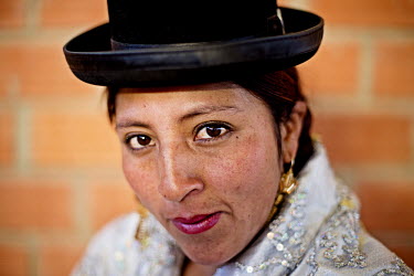 Juanita la Carinosa aka Mary Llanos (a Cholita or wrestler of native Aymara descent), one of the key figures in a breakaway group of independent wrestlers who broke away from the most dominant organis...