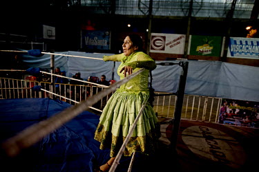 Marta La Altena (a Cholita or wrestler of native Aymara descent) shows 'fear' as the tides turn for the umpteenth time during her bout at the 12 October Stadium in the El Alto district.