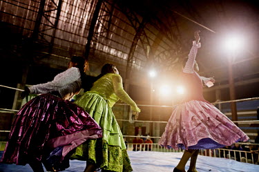 Dina La Reina Del Ring (a Cholita or wrestler of native Aymara descent, right of picture) comes to the aid of Denita La Intocable during the latter's bout with 'bad-girl' Marta La Altena.