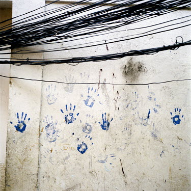 Hand prints on the wall of a part-demolished house. At 115 years old, Providencia is Rio de Janeiro's oldest favela, originally formed when veterans of the bloody Canudos war in Brazil's northeast mov...
