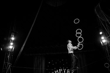 A tightrope walker juggels rings during a perfomance at the Emprye Family Circus show in Fortaleza. The Empyre Family Circus is the 5th generation of the travelling show. Most of the performers are me...