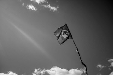 A flag of the MST (Movimento dos Trabalhadores Rurais Sem Terra) flies outside the Ipirange campsite. Ipiranga is a squatter's camp for landlesss workers in Pernambuco state. As a part of Movimento do...