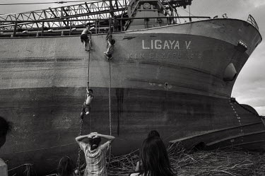 Children play near a ship driven close to a kilometer inland by the storm surge, Tacloban. Typhoon Haiyan, or Yolanda as it is known in the Philippines, made landfall on 8 November 2013 and was one of...