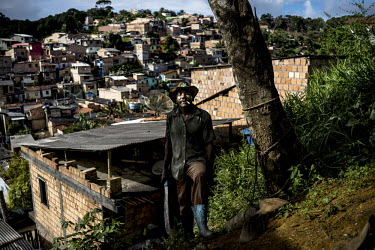 A local man stands next to a tree on the outskirts of Camamu.