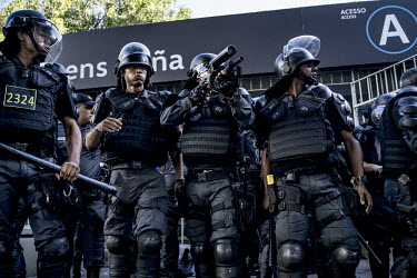 Riot police face rioters in the North Zone of Rio before the Germany vs Argentina final of the 2014 Football World Cup which Germany won 1:0.