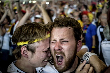 Fans of the Germany football squad cheer  their team at the Maracana stadium in Rio de Janeiro during the final match of the 2014 Football World Cup. Germany beat Argentina 1:0 to win the Cup.