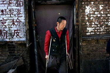 A man (who did not want to give his name) who lost his leg in a coal mining accident at a residential complex housing workers, and their dependants, of the Datong Coal Mine Group's (Tong Mei) Yong Din...