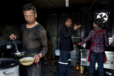 Coal miners serve themselves lunch at the Datong Coal Mine Group's (Tong Mei) Tong Xiu coal mine.