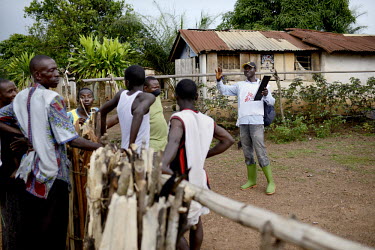 A MSF (Doctors Without Borders) staff member talks to residents of Teldou village about the eEbola virus as an epidemic of unprecedented proportions spreads fear throughout West Africa. The virus has...