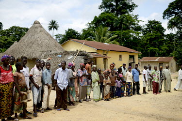 Inhabitants of Bawa waiting for the arrival of the Prefect, Mohammed Cinq Keita in the village. He visited to give a speech about the Ebola virus to the population. An Ebola virus epidemic of unpreced...