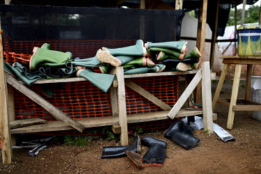 Rubber boots used by MSF (Doctors Without Borders) staff at a field hospital, set up to fight an outbreak of Ebola virus in Gueckedou. An Ebola virus epidemic of unprecedented proportions has broken o...