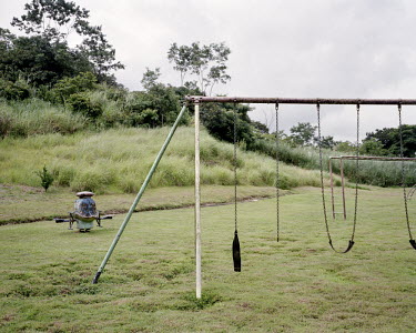 A disused children's swing in a playground in Cardenas, a township in the Panama Canal Zone originally founded to house Federal Aviation Administration (FAA) and Middle America Research Unit (MARU) st...