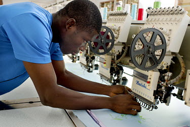 A worker operates an embriodery machine at Winglow, a textile and fashion business in Accra. Awurabena Okrah, CEO and founder of Winglow, was able to obtain a USD 24,000 (GBP 14,226) finance lease thr...