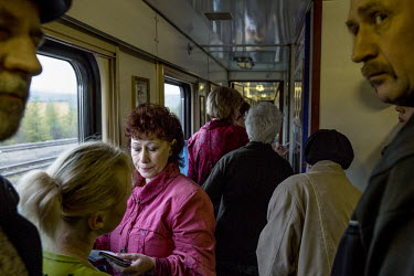 People line up in the corridor of the Matvei Mudrov train to register before going to see a doctor.   The Matvei Mudrov train is a medical train operated by Russian Railways along the course of the Ba...