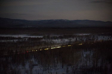 The Matvei Mudrov train travelling through the taiga at night. It usually travels during the night and is then ready for service in the morning in one of the hundreds of villages along the route of th...