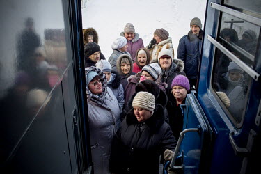 Villagers line up outside the door of the Matvey Mudrov train in -15C temperature, waiting for its doors to open at 9am. Most of the diagnostic services on the train are covered by public funding.  Th...