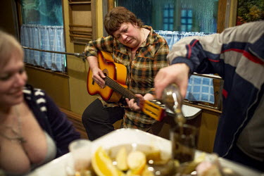 The medical team on board the Matvei Mudrov train celebrates Maslenitsa in the train's dining car, drinking vodka and playing music. Maslenitsa is an eastern Slavic festival which is celebrated to mar...