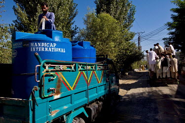 A Handicap International water truck delivers supplies following the devastating floods that hit the country in July 2010.