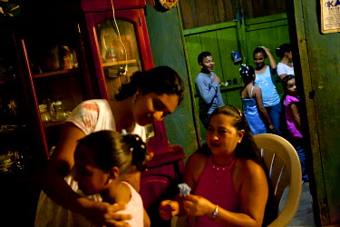 Yessina, a young girl about to turn 15, and her cousins gets ready for her qiunceanera (girl's 15th birthday). It is often thought that a quinceanera is a way for a girl's parents to show possible sui...