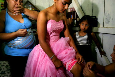 Yessina, a young girl about to turn 15, gets ready for her qiunceanera (girl's 15th birthday) with help from her aunts. It is often thought that a quinceanera is a way for a girl's parents to show pos...